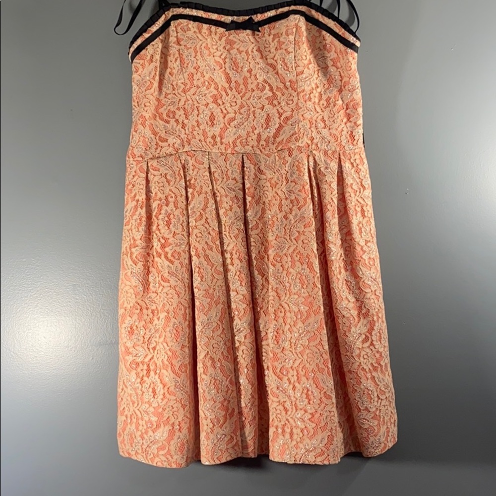 Strapless lace and coral dress